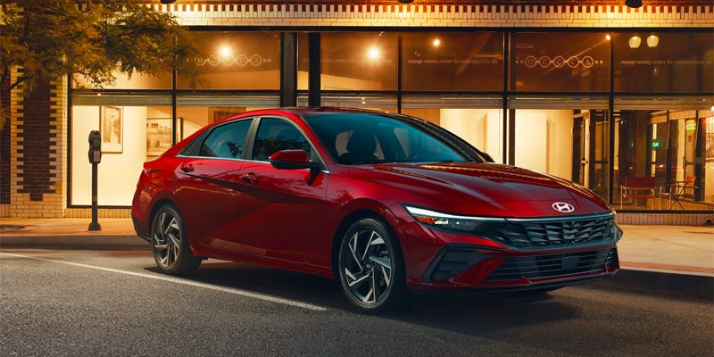 Hyundai Elantra parked by an apartment