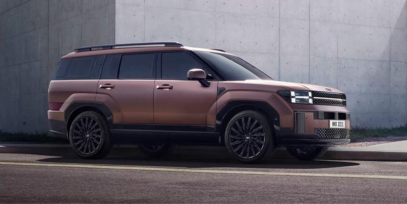 Hyundai Santa Fe parked roadside near a building