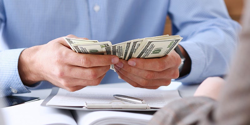 Bentley Hyundai in Huntsville AL customer holding cash